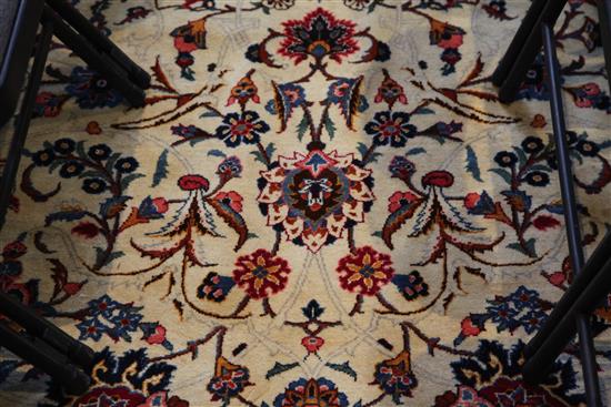 A Kashan ivory ground carpet, 14ft 3in by 10ft 7in.